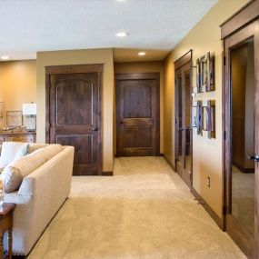 Cozy living room featuring interior barnwood doors and trim, radiating rustic charm.