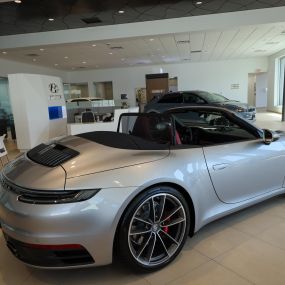 Hyundai of Newport Showroom with Porsche on display