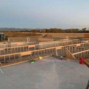 New home under construction, with the foundation completed and the crawl space being framed. The construction site is impeccably clean, showcasing a well-organized and promising start to the project.