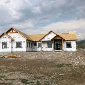 New home under construction, awaiting siding and roofing. The construction site is exceptionally clean, reflecting a well-maintained and organized environment.