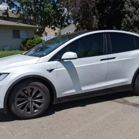 We did a chrome delete on this 2018 Tesla Model X with a satin black vinyl wrap.