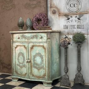 A beautiful side table painted with Dixie Belle Chalk Mineral Paint and hand-painted scrolls.