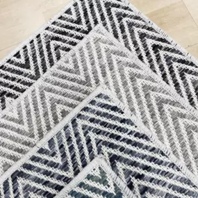 Chevron carpet samples in multiple colors.