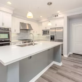 Granite kitchen countertop remodel with stainless steel appliances and hardwood floors