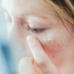 Advanced Dermatology & Skin Cancer Specialists - woman placing cream on eye