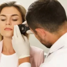 Desert Dermatology & Skin Cancer Specialists - doc examining womans face