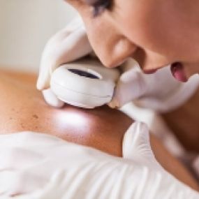 Desert Dermatology & Skin Cancer Specialists - DOC EXAMINING SKIN