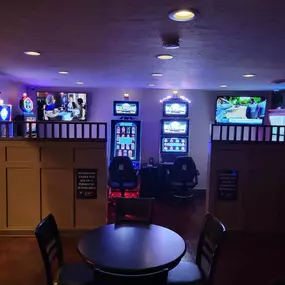 Array of slot machines, each offering a unique theme and chance for big wins at Lucky 7's Lounge.