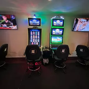 Detailed shot of a slot machine's vibrant display, showcasing the variety of games available at Lucky 7's Lounge.