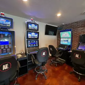 Lucky 7's Lounge features a dedicated section for slot machines, each with unique themes and captivating visuals. This image highlights the variety of gaming options available for visitors.