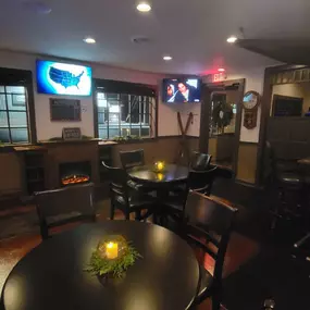 Cozy seating and warm lighting at Lucky 7's Lounge in Somonauk, Illinois, providing a welcoming environment for guests.