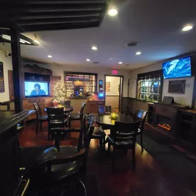 Inside Lucky 7's Lounge in Somonauk, Illinois, patrons enjoying drinks and good company in a relaxed setting.