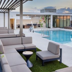 Rooftop pool with expansive sundeck and seating.
