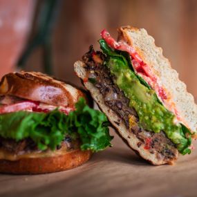 Housemade Black Bean Burger on a panini pressed Pretzel Roll