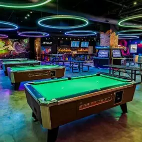 There's always sharks in the water at Asylum Bar + Arcade. Stop by for some billiards today.