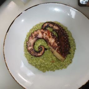 Risotto spinach Parmesan with grill octopus on top