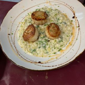 Risotto Parmesan with mascarpone cheese  mango  and jumbo scallops on top