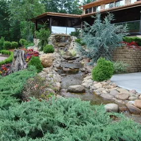 Pasadena Villa Smoky Mountain Lodge: Exterior photo of the front of our residential treatment center's garden area with a beautiful waterfall.