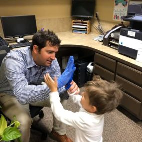 Dr. Winegar And Son Share High Fives