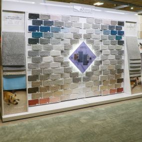 Display of Shaw carpet samples, featuring a variety of colors and textures.
