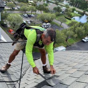 Meet Mike Felicone, our main crew foreman demonstrating how to properly conduct repairs seven stories up on a 1012 pitch roof. Safety first, always!