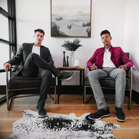 Sapien Designs' Multimedia Studios captured this image showing two men seated in a modern office, highlighting their SEO digital marketing capabilities.