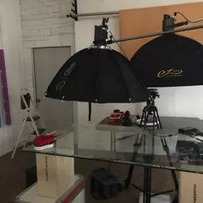 Sapien Designs' Multimedia Studios created this professional image featuring a studio setup with a person in a suit being recorded, highlighting their SEO digital marketing capabilities.