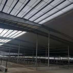 Steel Concepts Inc. delivers high-quality, durable steel structures for agricultural and industrial applications. This modern, open-air cattle facility features a robust steel frame with skylights for natural lighting, ensuring ventilation and efficiency. Built to withstand the elements, our structures prioritize functionality and longevity.