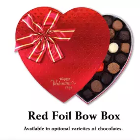 Florence’s Exquisite Chocolates in Rexburg, ID, presents a premium red foil bow heart-shaped box filled with 36 handcrafted chocolates. This stunning gift box, embossed with heart patterns and finished with a red and gold bow, is the perfect way to celebrate Valentine’s Day. Inside, you'll find an assortment of 36 milk, dark, and white chocolates, each with unique designs and delicious fillings, offering a decadent treat for any chocolate lover.