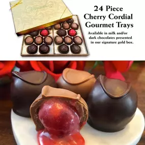 A gourmet chocolate display featuring Florence's Exquisite Chocolates in Rexburg, ID. The image showcases a 24-piece Cherry Cordial Gourmet Tray, available in both milk and dark chocolates, presented in a signature gold box. The chocolates are arranged neatly in two trays, with a mix of milk and dark chocolate pieces, some topped with a cherry. The lower part of the image provides a close-up view of the chocolates, highlighting the rich, glossy exterior and the luscious cherry filling inside one