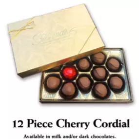 A luxurious box of Florence's Exquisite Chocolates from Rexburg, ID, featuring 12 handcrafted cherry cordial chocolates. The elegant gold packaging, tied with a delicate ribbon, enhances the premium presentation. Inside, smooth milk and dark chocolates encase luscious cherry fillings, offering a perfect balance of sweetness and richness. This beautifully curated box is ideal for gifting or personal indulgence, showcasing Florence’s dedication to high-quality confectionery.