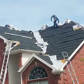 Springtree Restoration Roofing Team is in action on the work-in-progress project.
