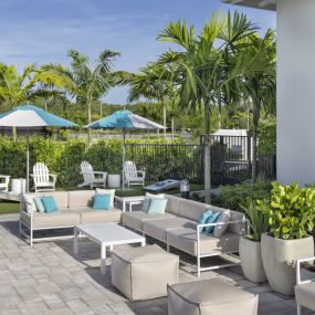 Lounge Seating on the Pool Deck at Everly Luxury Apartments in Naples FL