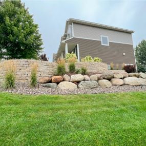 This retaining wall features many shapes and different materials for an interesting and stunning design