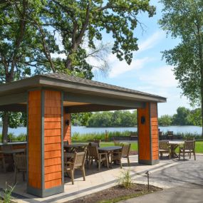 a lake side pavilion is the perfect place to sit and enjoy the scenery