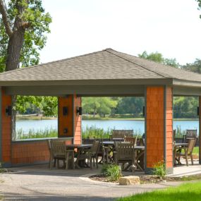 a lake side pavilion is the perfect place to sit and enjoy the scenery