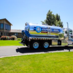 Express Septic Pumping truck parked out front of one of our customers who was very kind enough for us to do a photoshoot on their property.