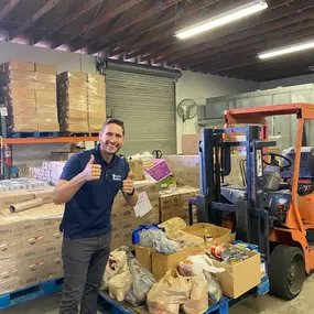 Cody at First Step Food Bank for 300 pound donation