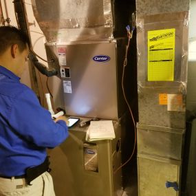 Garneski-Air-Conditioning-and-Heating-service-technician-at-work