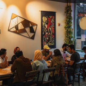 Customers chatting while their food was being served indoors at the Wakatobi Newark location