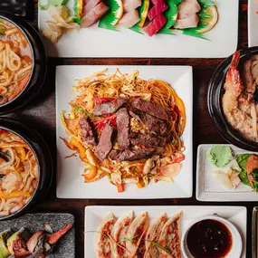 Variety of noodles, soup, seafood, sushi rolls, and gyoza dishes at Wakatobi Japanese Grill Hibachi and Sushi