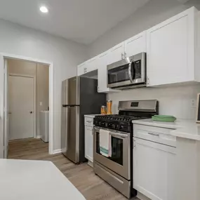 Kitchen With Stainless Steel Appliances & White Cabinets