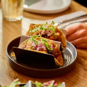 Our beef gringa taco, made with a grilled cheese tortilla, slow-cooked regenerative beef, fresh pico de Gallo salsa and microherbs