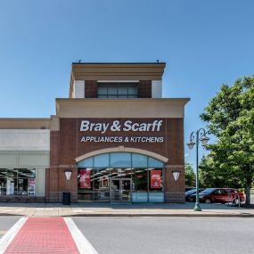 Outside view a brick building with white sign that reads 