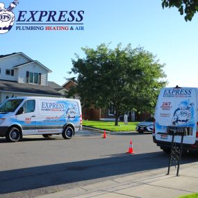 Express Plumbing Heating & Air vans servicing two different customers in the same neighborhood the same day.