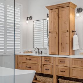 A Port St. Lucie bathroom renovation using Showplace Cabinetry, Pompeii Quartz and frameless glass