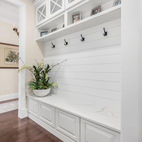 A custom entry feature with built-in bench and ship-lap wall.
