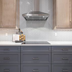 Updated kitchen with gorgeous glass tiles and Showplace cabinetry