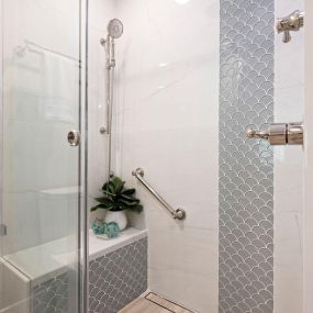 Mermaid vibes in this updated Master Bathroom! Also includes frameless glass.