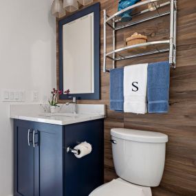 Powder Bath remodel with Showplace cabinetry and shiplap walls.